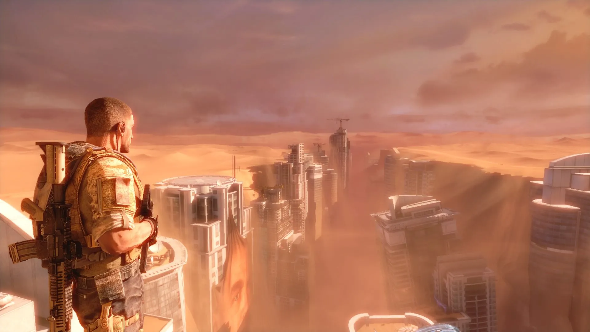 Ảnh chụp màn hình chính thức của Spec Ops: The Line, hiển thị một cảnh chiến đấu trong môi trường đổ nát của Dubai, với hiệu ứng khói và ánh sáng yếu, tạo cảm giác khắc nghiệt và chân thực của chiến tranh