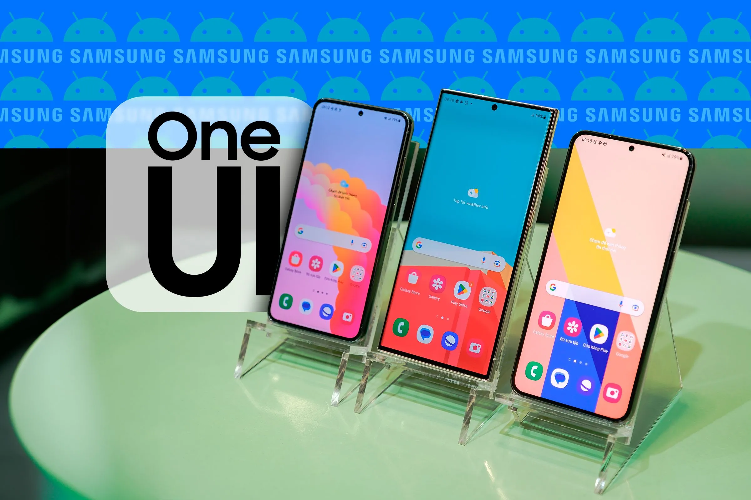 Ba điện thoại Samsung đặt cạnh nhau hiển thị giao diện One UI, logo One UI bên cạnh và logo Samsung cùng Android ở nền.