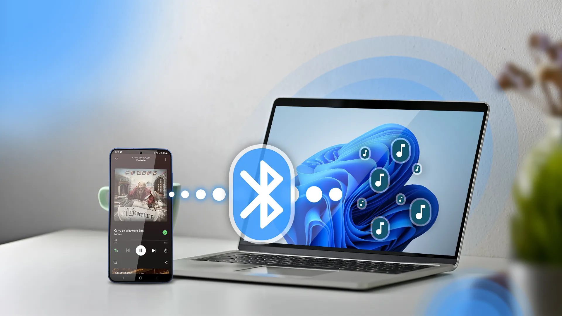 Điện thoại và laptop Windows 11 cạnh nhau, với biểu tượng Bluetooth ở giữa