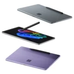 Hai chiếc máy tính bảng Microsoft Surface Pro mới màu xanh và xám, đặt trên mặt phẳng, kèm theo bút Surface Slim Pen, thể hiện thiết kế mỏng nhẹ và tính năng cảm ứng.