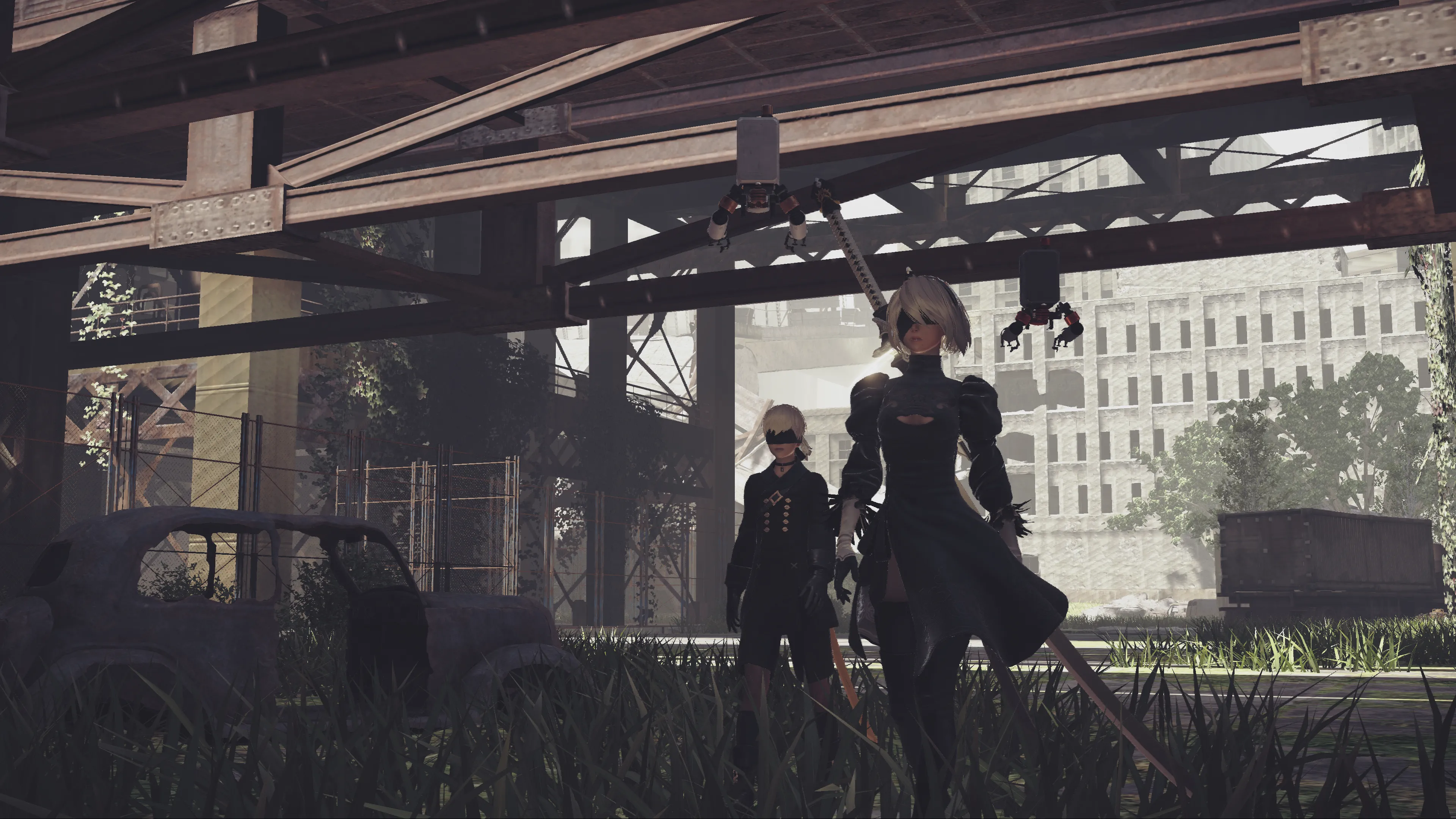 Hai nhân vật chính 2B và 9S trong môi trường hậu tận thế tuyệt đẹp của NieR Automata.