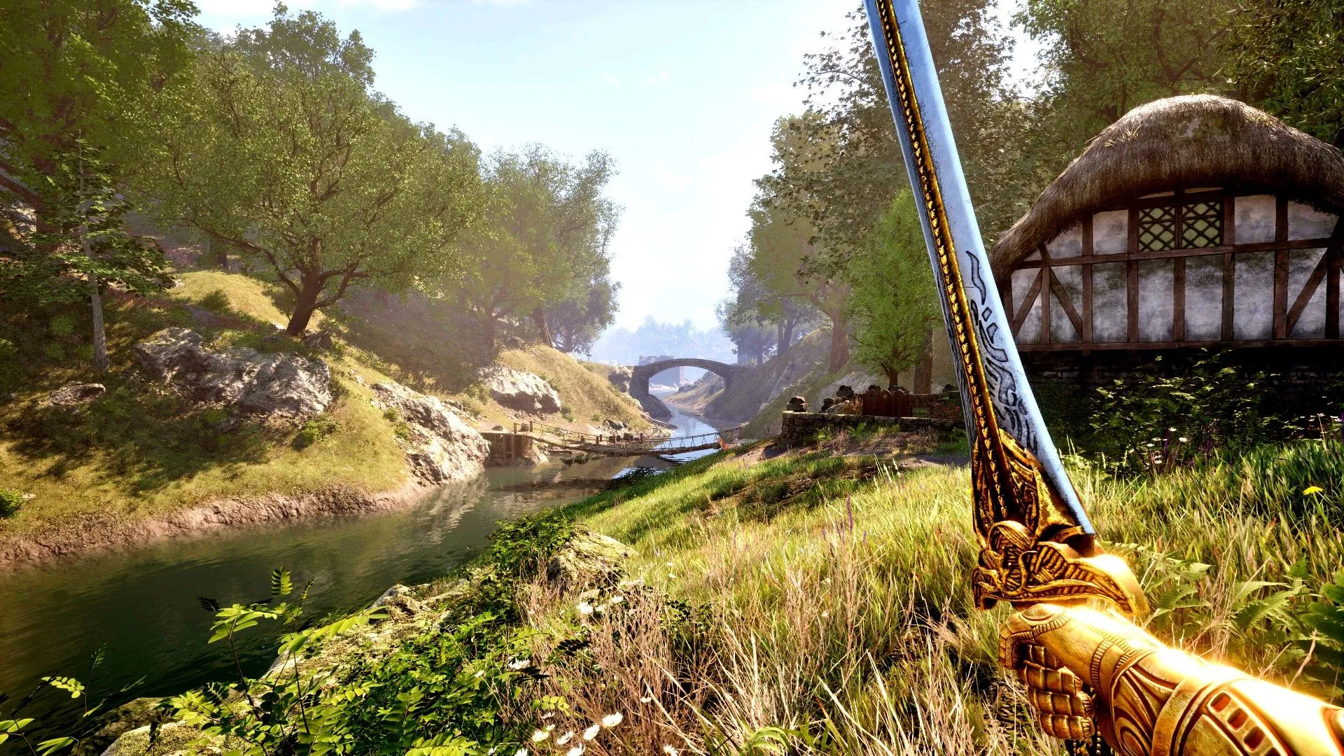 Nhân vật game cầm kiếm đứng bên bờ sông ngắm cảnh nhà cửa trong The Elder Scrolls IV Oblivion Remastered.